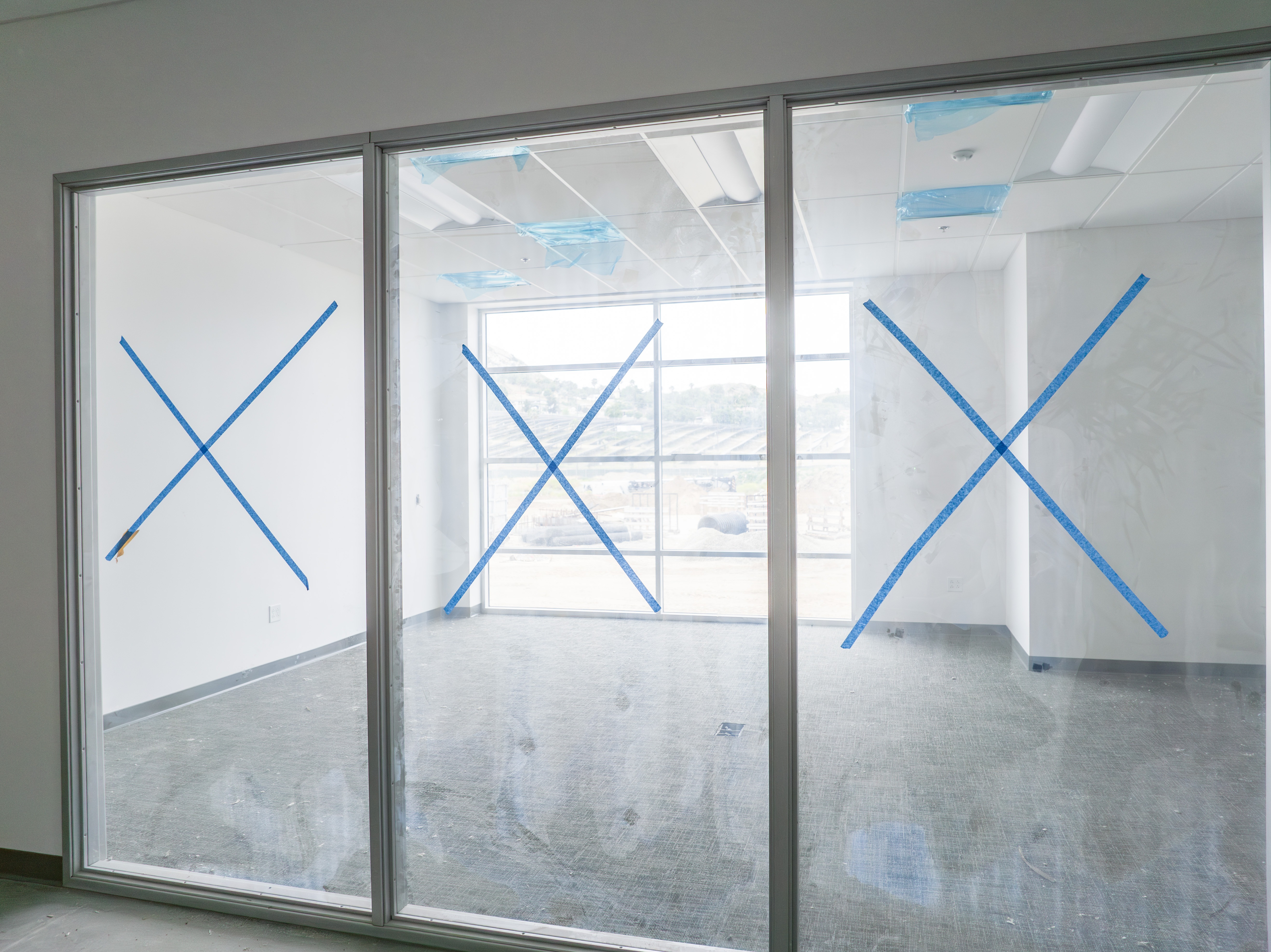 DJI_0572-Enhanced-NR glass walls for an office with tape x's on them