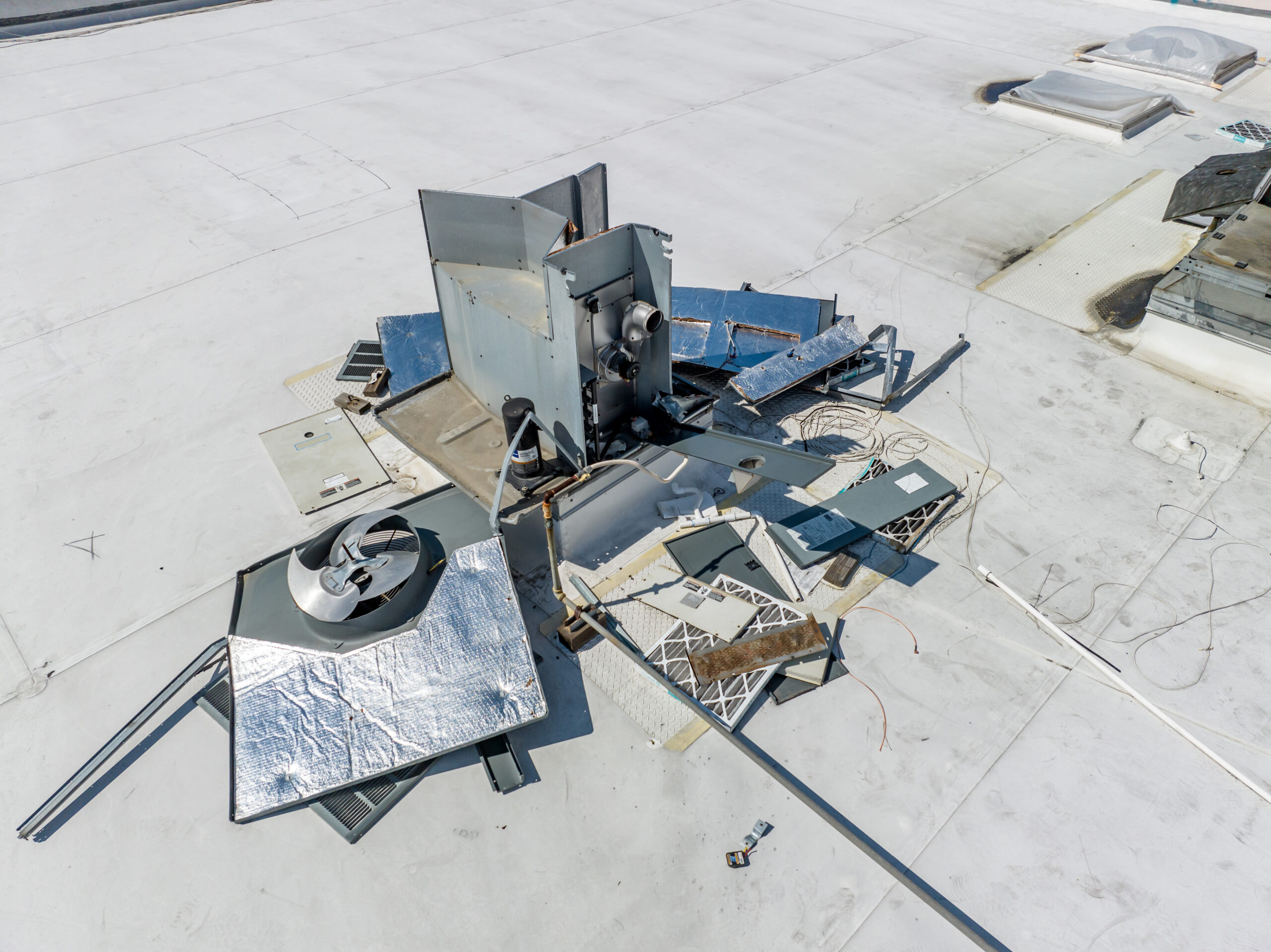 Torn apart equipment at abandoned car dealership