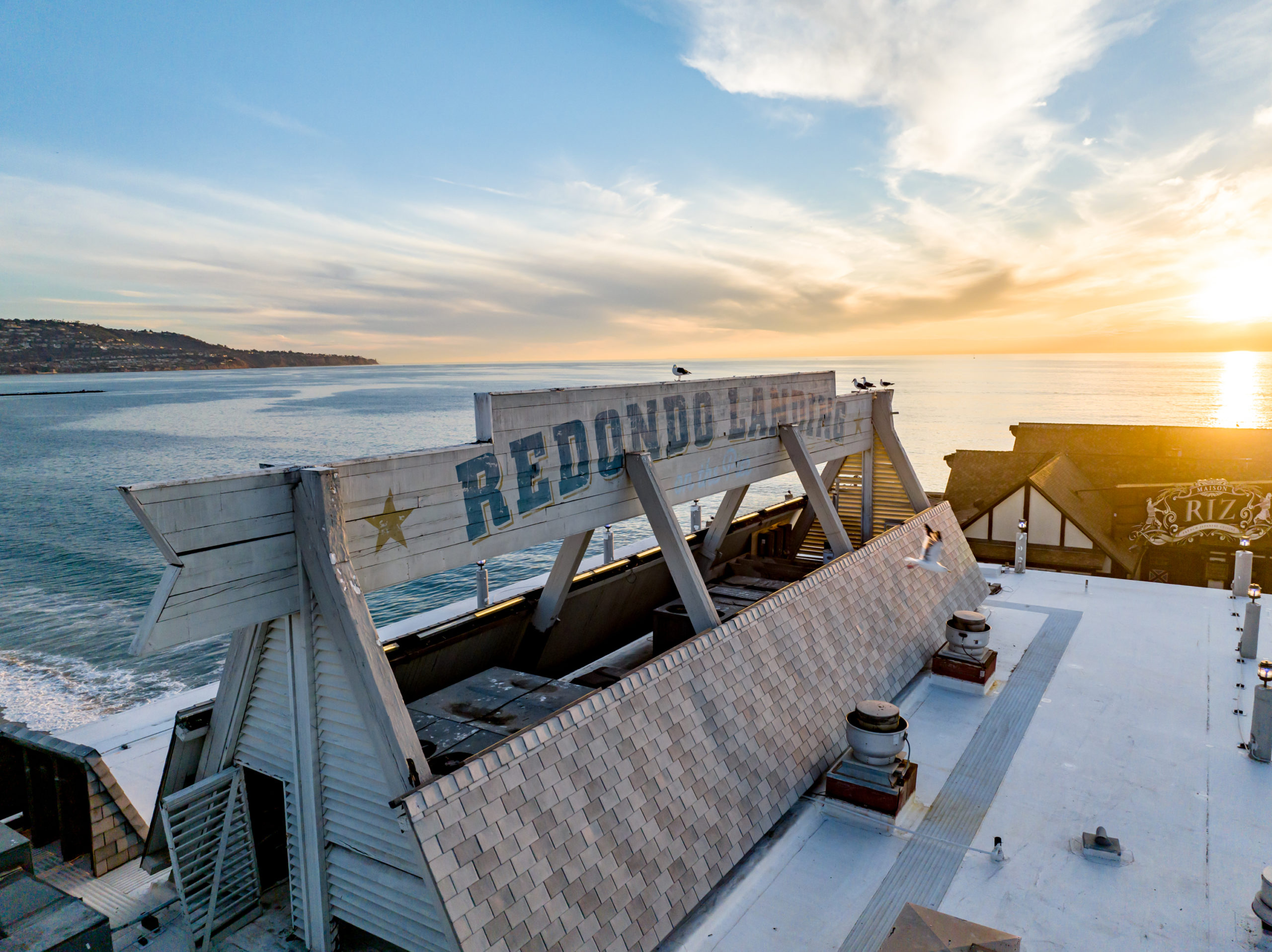 Redondo Beach pier signage at sunset